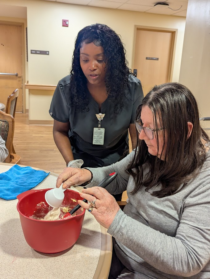 caregiver assisting senior resident