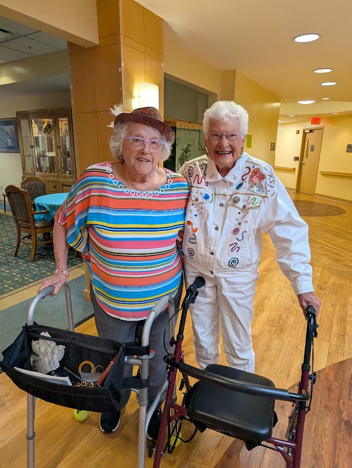 senior friends embracing